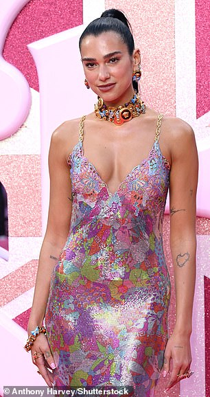 Working the cameras: Dua posed up a storm for the camera in the plunging gown