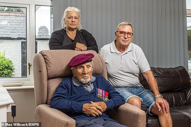 Christopher Chope, the MP for Christchurch, branded the veteran's treatment as 'disgusting'. Alfred is pictured with his daughter Deb and her husband Bernard Dean (right)