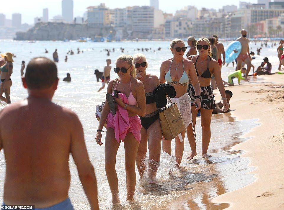 British tourists are revelling in the heat and enjoying sunbathing on beaches across Benidorm in Spain