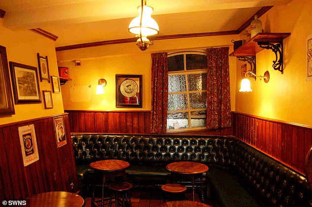 Inside the pub, the windows and walls all appeared crooked due to a bizarre effect through subsidence caused by mining in the 1800s. The interior of the pub is pictured before the blaze