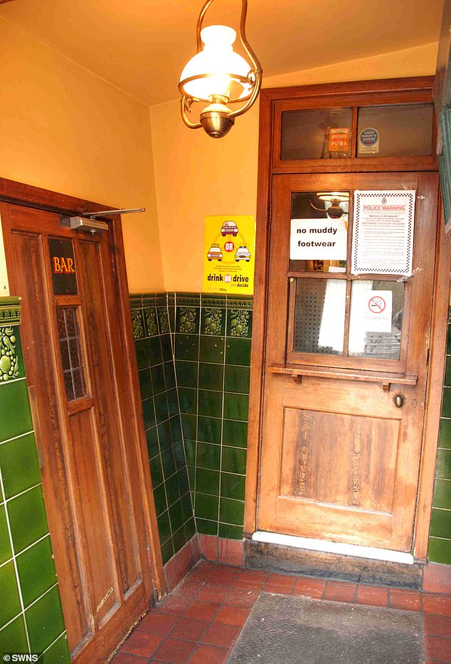 The leaning boozer of Himley was built in 1765 as a farmhouse. The interior of The Crooked House Pub is pictured before the fire