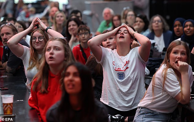 The decision to send James off left England fans watching the game outside Wembley Stadium devastated (pictured)