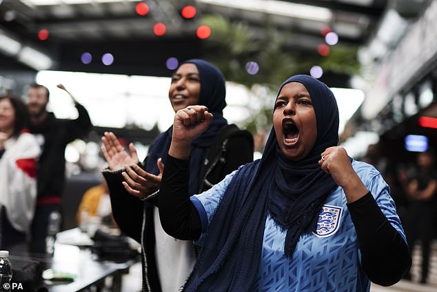 Jubilant England fans at the Boxpark Wembley celebrate as the Lionesses progress to the quarter finals