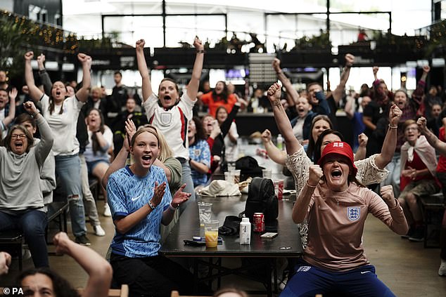 The win sent England fans wild, with scores across the country watching the clash in pubs. Pictured: Supporters celebrating at Boxpark Wembley