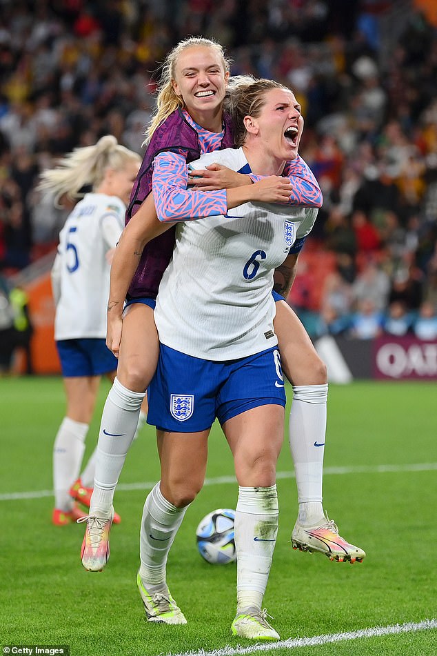 Millie Bright and Esme Morgan of England celebrate the team's victory through the penalty shoot out