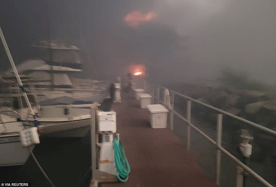 The fires, fanned by strong winds from Hurricane Dora, have burned structures, forced evacuations and caused power outages in several communities