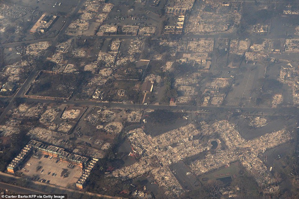 An aerial view of destroyed buildings as the wildfire burns in the historic town of Lahaina, Hawaii