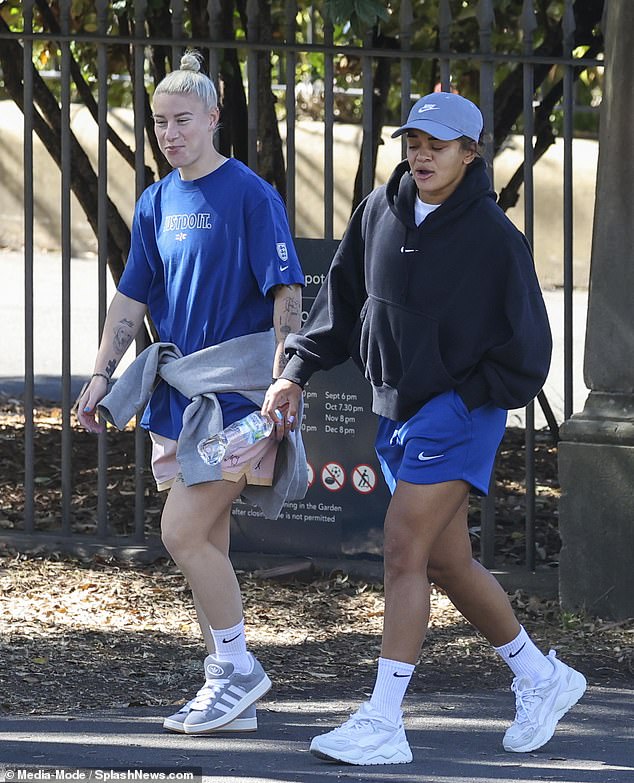 Bethany England and Jess Carter look relaxed on the Lionesses' walkabout in Sydney