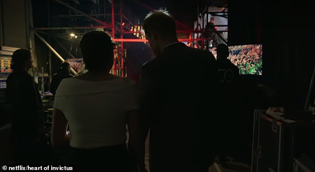 Another snippet shows the couple walking out onto the stage at the games, with Meghan saying it 'looks incredible'