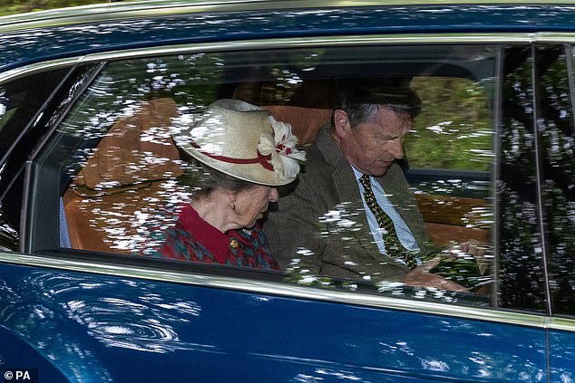 The Princess Royal donned a maroon and grey dress jacket with a straw boater and red trim for the short journey to Crathie Kirk
