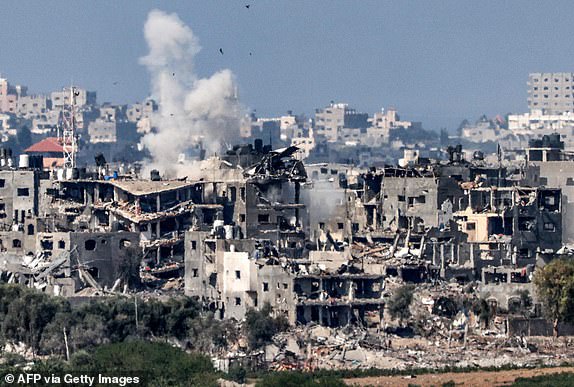 This picture taken from Israel's southern city of Sderot shows a smoke plume erupting during Israeli bombardment in the northern Gaza Strip on October 19, 2023, amid ongoing battles between Israel and the Palestinian group Hamas. Thousands of people, both Israeli and Palestinians have died since October 7, 2023, when Palestinian Hamas militants in the Gaza Strip entered southern Israel in a surprise attack leading Israel to declare war on Hamas in Gaza on October 8. (Photo by Jack Guez / AFP) (Photo by JACK GUEZ/AFP via Getty Images)