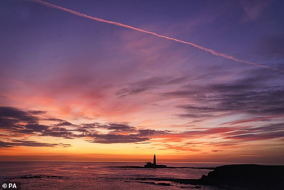 Dawn at St Mary's Lighthouse in Whitley Bay off the North East coast. Picture date: Monday October 23, 2023. PA Photo. See PA story WEATHER Autumn. Photo credit should read: Owen Humphreys/PA Wire