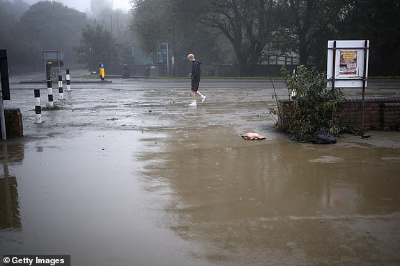 ROTHERHAM, UNITED KINGDOM - OCTOBER 23: Residents view the aftermath as flood waters begin to recede in the village of Catcliffe after Storm Babet flooded homes, business and roads on October 23, 2023 in Rotherham, United Kingdom. The UK Environment Agency has warned that flooding could last for days in the wake of Storm Babet with 116 flood warnings remaining in place across England. (Photo by Christopher Furlong/Getty Images)