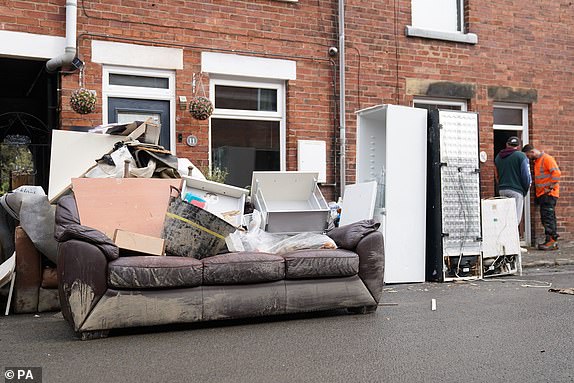 Damaged furniture from outside a property on Sherwood Street in Chesterfield, as the clean up begins in the aftermath of Storm Babet which battered the UK, causing widespread flooding and high winds.  Picture date: Monday October 23, 2023. PA Photo. See PA story WEATHER Babet. Photo credit should read: Joe Giddens/PA Wire