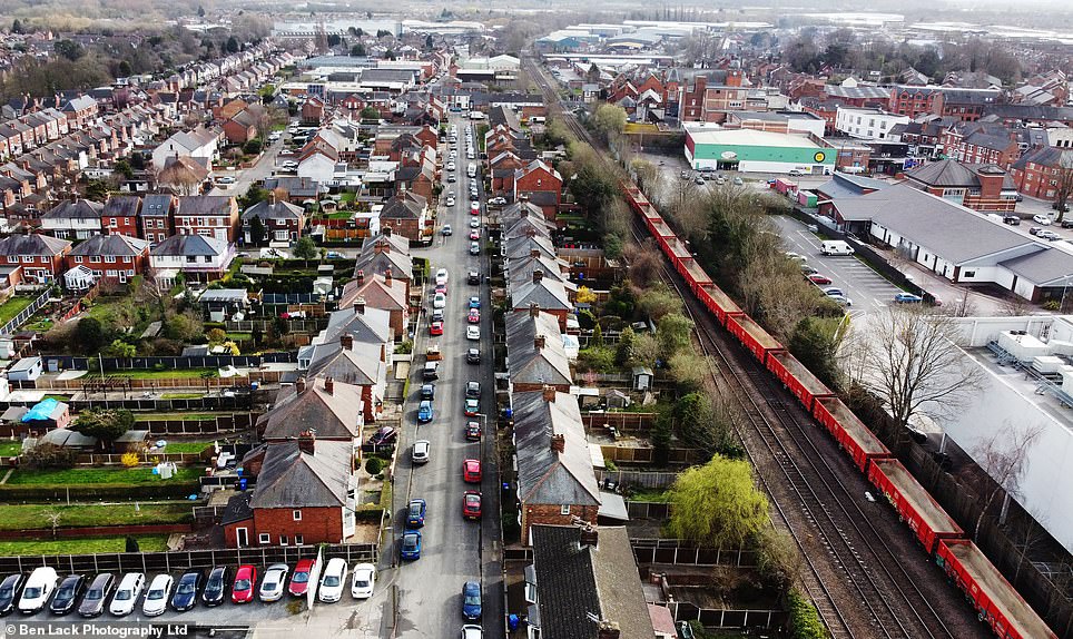 Homes beside the existing railway line on Bonsall Street (pictured) in Long Eaton, Derbyshire, face an uncertain future. The proposed HS2 line is set to tear through the community, but only last month it was reported the Government is considering scrapping  the eastern leg of the high speed line altogether, meaning it wouldn't reach them at all.