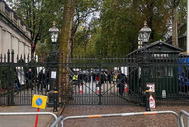 Dozens of police officers amassed outside the Israeli embassy on Saturday morning