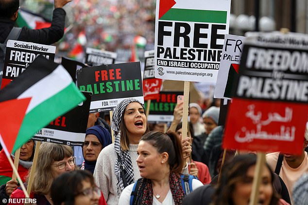 Demonstrators held large signs and banners as they protested for the second weekend in a row