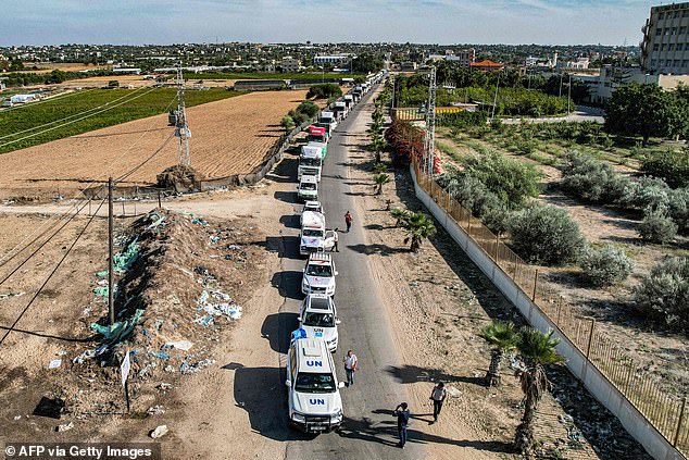 Humanitarian aid trucks arriving from Egypt after having crossed through the Rafah border crossing arriving at a storage facility in Khan Yunis in the southern Gaza Strip