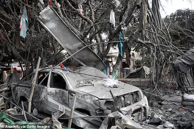 Wreckage of collapsed buildings and trees in the southern city of Rafah, Gaza, on Saturday