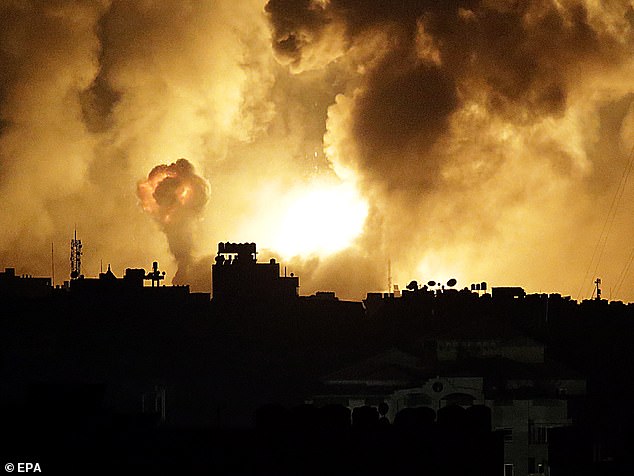 Fire and smoke illuminate the skies over Gaza on Friday night as Israel's bombardment of 150 'underground targets' got underway. This photograph was issued hours later on Saturday; journalists within Gaza have not been able to circumvent the communications blackout