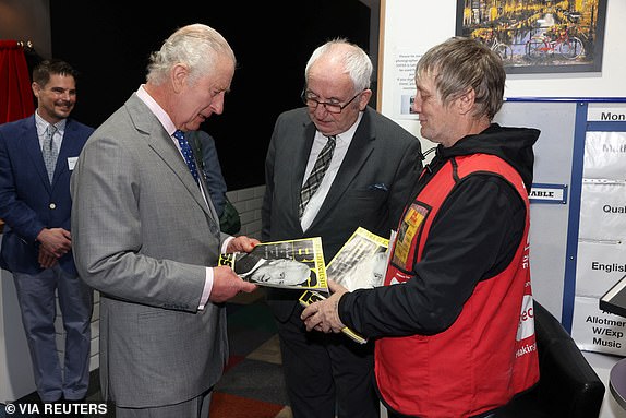 Britain's King Charles and Queen Camilla (not pictured) visit FareShare Didcot to launch the Coronation Food Project on his birthday, in Didcot, Britain, November 14, 2023. The King bought a copy of the Big Issue from seller Kelvin along with Lord John Bird the founder of the Big Issue. Ian Vogler/Pool via REUTERS