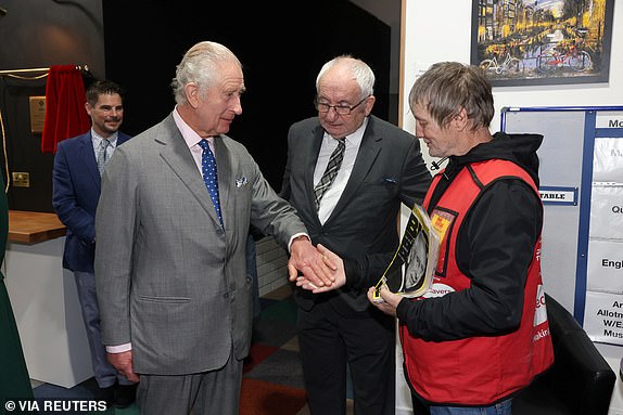 Britain's King Charles and Queen Camilla (not pictured) visit FareShare Didcot to launch the Coronation Food Project on his birthday, in Didcot, Britain, November 14, 2023. The King bought a copy of the Big Issue from seller Kelvin along with Lord John Bird the founder of the Big Issue. Ian Vogler/Pool via REUTERS