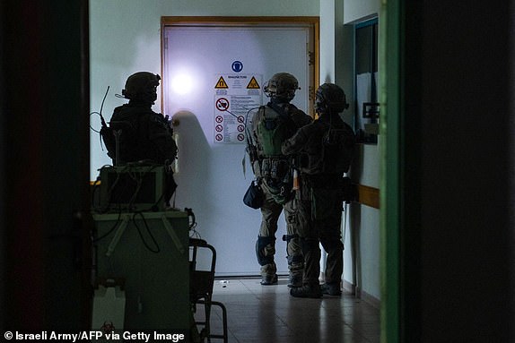 TOPSHOT - This handout picture released by the Israeli army on November 15, 2023, reportedly shows Israeli soldiers carrying out operations inside Al-Shifa hospital in Gaza City, amid continuing battles betweeen Israel and the Palestinian militant group Hamas. (Photo by Israeli Army / AFP) / RESTRICTED TO EDITORIAL USE - MANDATORY CREDIT "AFP PHOTO / ISRAELI ARMY " - NO MARKETING NO ADVERTISING CAMPAIGNS - DISTRIBUTED AS A SERVICE TO CLIENTS (Photo by -/Israeli Army/AFP via Getty Images)