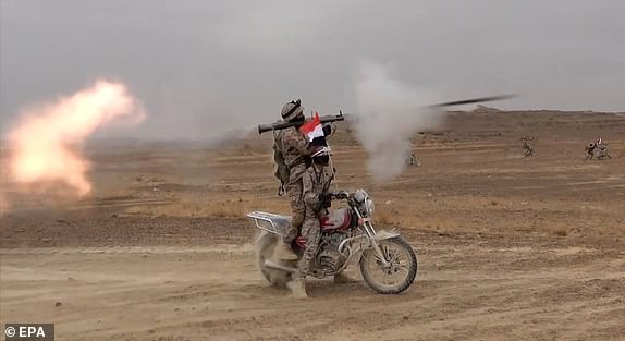 epa10951172 A handout photo made available by the Houthis media center shows Houthi fighters taking part in a military maneuver to express solidarity with the Palestinian people on the outskirts of Sana'a, Yemen, 29 October 2023 (Issued 31 October 2023). The Houthis announced on 31 October 2023 that they had launched ballistic missiles and drones towards Israel in support of the Palestinian people amid the ongoing conflict between Israel and Hamas. Thousands of Israelis and Palestinians have died since the militant group Hamas launched an unprecedented attack on Israel from the Gaza Strip on 07 October, and the Israeli strikes on the Palestinian enclave which followed it.  EPA/HOUTHIS MEDIA CENTER / HANDOUT EDITORIAL USE ONLY/NO SALES HANDOUT EDITORIAL USE ONLY/NO SALES HANDOUT EDITORIAL USE ONLY/NO SALES