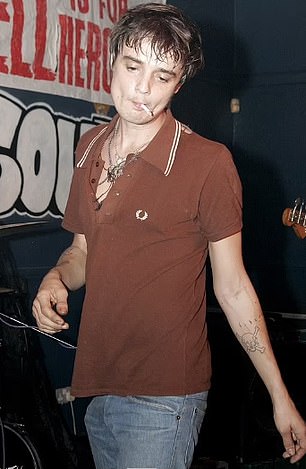 Brutal: Footage in the documentary shows him pulling a black band around his arm as he melts the drug on a spoon above a flame (pictured in 2006)