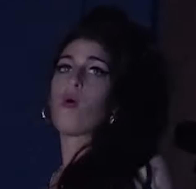 Belting it out: A glimpse of his good friend Amy Winehouse saw the troubled star looking upon one of his gigs, in an insight into their relationship - which Pete previously alleged evolved into a romantic relationship prior to her 2011 death aged 27