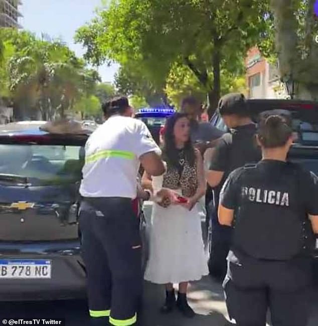 Agustina Scalia (pictured, centre) was robbed of over £18,000 worth of Pesos in a shock armed robbery today