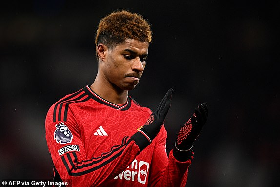 Manchester United's English striker #10 Marcus Rashford applauds the fans following the English Premier League football match between Manchester United and Chelsea at Old Trafford in Manchester, north west England, on December 6, 2023. Manchester United won the match 2-1. (Photo by Oli SCARFF / AFP) / RESTRICTED TO EDITORIAL USE. No use with unauthorized audio, video, data, fixture lists, club/league logos or 'live' services. Online in-match use limited to 120 images. An additional 40 images may be used in extra time. No video emulation. Social media in-match use limited to 120 images. An additional 40 images may be used in extra time. No use in betting publications, games or single club/league/player publications. /  (Photo by OLI SCARFF/AFP via Getty Images)