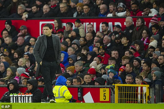 Bournemouth's head coach Andoni Iraola reacts during the English Premier League soccer match between Manchester United and Bournemouth at the Old Trafford stadium in Manchester, England, Saturday, Dec. 9, 2023. (AP Photo/Jon Super)
