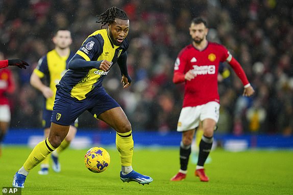 Bournemouth's Antoine Semenyo controls the ball during the English Premier League soccer match between Manchester United and Bournemouth at the Old Trafford stadium in Manchester, England, Saturday, Dec. 9, 2023. (AP Photo/Jon Super)