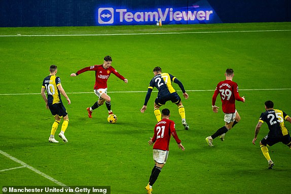 MANCHESTER, ENGLAND - DECEMBER 09: Alejandro Garnacho of Manchester United in action with Illya Zabarnyi of AFC Bournemouth during the Premier League match between Manchester United and AFC Bournemouth at Old Trafford on December 09, 2023 in Manchester, England. (Photo by Ash Donelon/Manchester United via Getty Images)