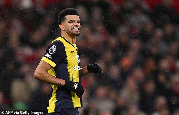Bournemouth's English striker #09 Dominic Solanke reacts after hitting the post during the English Premier League football match between Manchester United and Bournemouth at Old Trafford in Manchester, north west England, on December 9, 2023. (Photo by Oli SCARFF / AFP) / RESTRICTED TO EDITORIAL USE. No use with unauthorized audio, video, data, fixture lists, club/league logos or 'live' services. Online in-match use limited to 120 images. An additional 40 images may be used in extra time. No video emulation. Social media in-match use limited to 120 images. An additional 40 images may be used in extra time. No use in betting publications, games or single club/league/player publications. /  (Photo by OLI SCARFF/AFP via Getty Images)