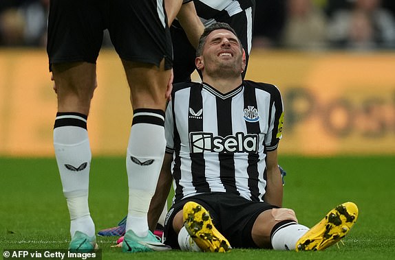 Newcastle United's Swiss defender #05 Fabian Schar reacts after picking up an injury during the English Premier League football match between Newcastle United and Fulham at St James' Park in Newcastle-upon-Tyne, north east England on December 16, 2023. (Photo by ANDY BUCHANAN / AFP) / RESTRICTED TO EDITORIAL USE. No use with unauthorized audio, video, data, fixture lists, club/league logos or 'live' services. Online in-match use limited to 120 images. An additional 40 images may be used in extra time. No video emulation. Social media in-match use limited to 120 images. An additional 40 images may be used in extra time. No use in betting publications, games or single club/league/player publications. /  (Photo by ANDY BUCHANAN/AFP via Getty Images)