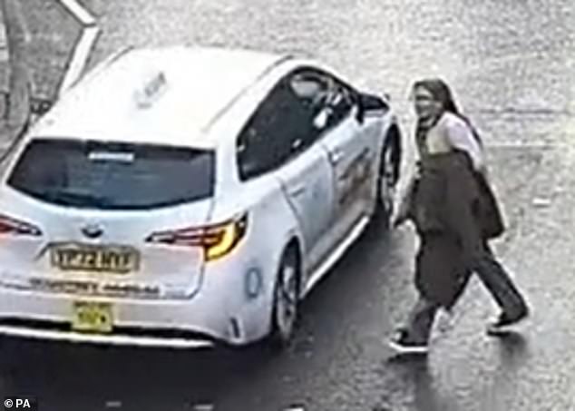 She makes her way onto Queens Street at 2.48pm before walking towards Norwich Cathedral