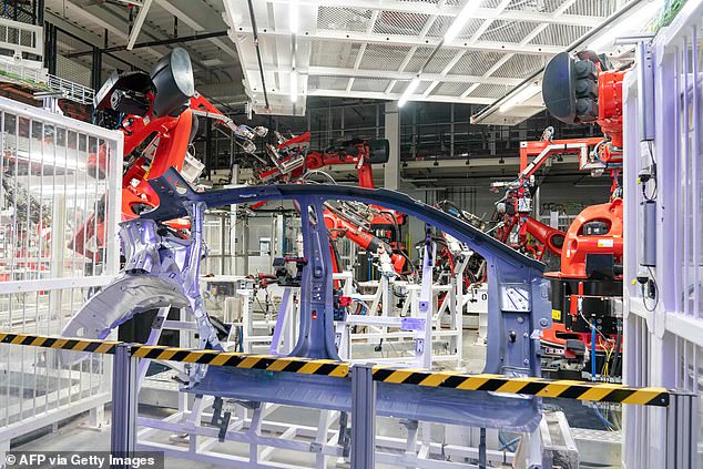 Two witnesses watched in horror as a fellow Tesla employee rescued the bloodied engineer from an unwitting, but violent robotic assault — perpetrated by an automated assembly device (like these red robot arms above) designed to grab and move freshly cast aluminum car parts