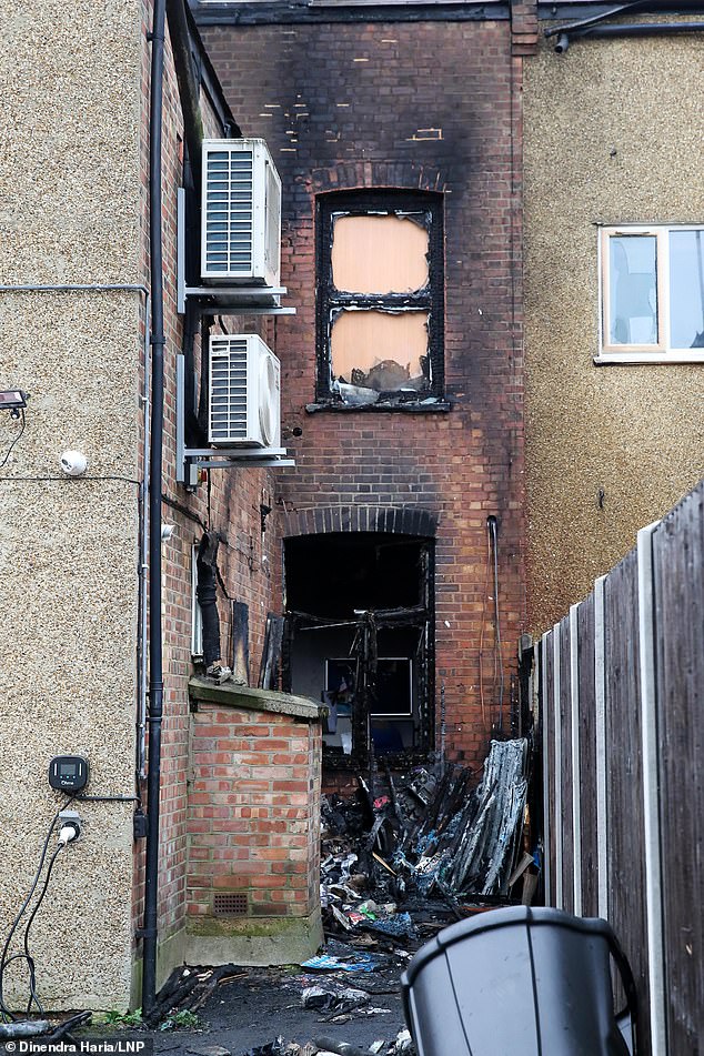 Burnt out windows at the rear of Conservative MP Mike Freer's office in Ballards Lane