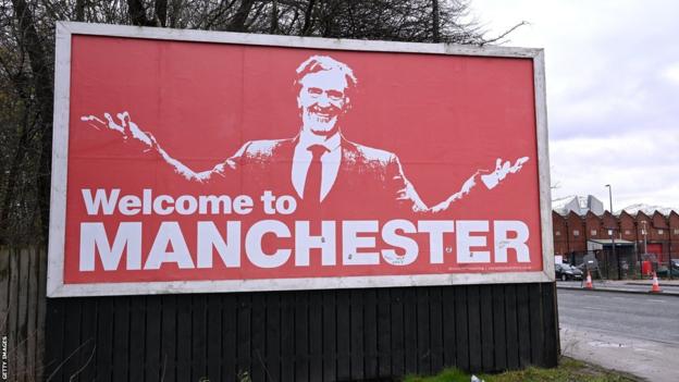 Sir Jim Ratcliffe billboard near Old Trafford