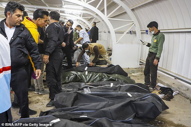 The bodies of victims killed in two explosions in Kerman lie at a hospital in the city on Wednesday