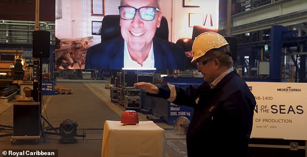 Ship happens: An executive hits the go button for construction to start on June 14, 2021