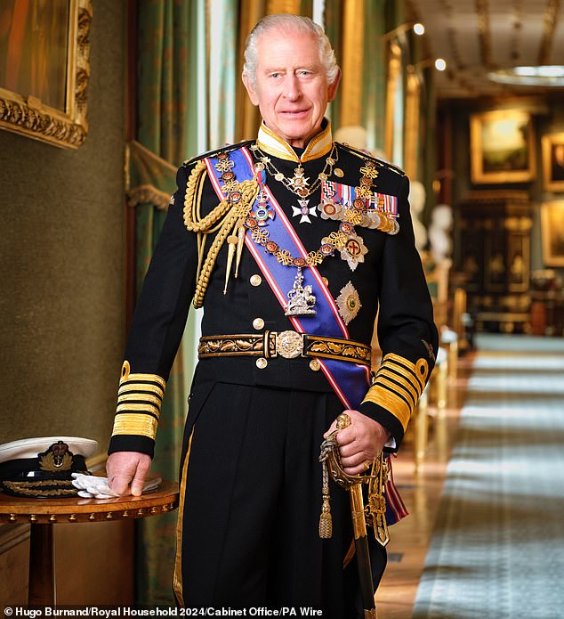 King Charles III is pictured in a portrait taken at Windsor Castle last year