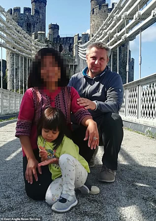 Bartlomiej Kuczynski, 45, pictured with one of his daughters