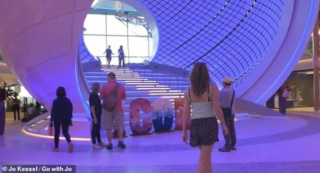 Jo is pictured here taking in Icon's Pearl feature - a giant, walk-through three-deck sphere installation