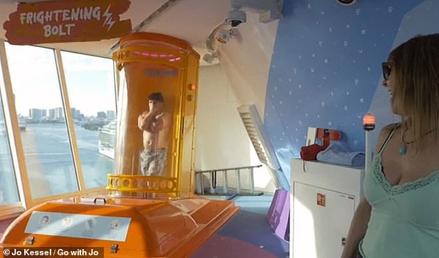 Jo watches a passenger brave Frightening Bolt - a 46-foot-tall drop slide