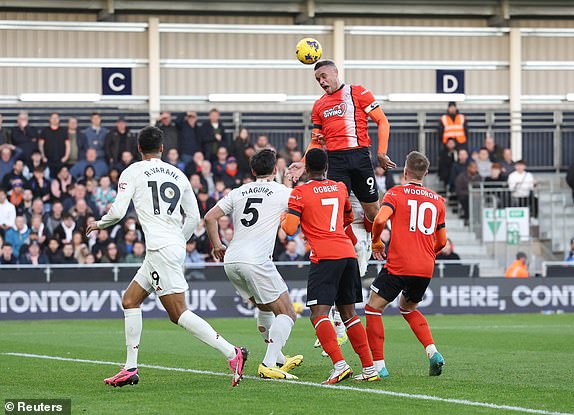 Soccer Football - Premier League - Luton Town v Manchester United - Kenilworth Road, Luton, Britain - February 18, 2024 Luton Town's Carlton Morris heads at goal REUTERS/Hannah Mckay NO USE WITH UNAUTHORIZED AUDIO, VIDEO, DATA, FIXTURE LISTS, CLUB/LEAGUE LOGOS OR 'LIVE' SERVICES. ONLINE IN-MATCH USE LIMITED TO 45 IMAGES, NO VIDEO EMULATION. NO USE IN BETTING, GAMES OR SINGLE CLUB/LEAGUE/PLAYER PUBLICATIONS.