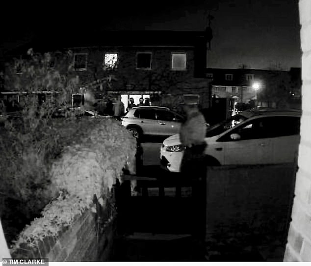 Officers were seen smashing in the doors of the property shortly after 2am