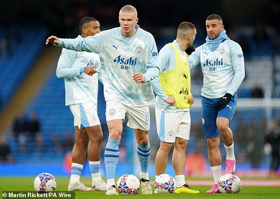 Manchester City's Erling Haaland warms up ahead of the Emirates FA Cup quarter-final match at the Etihad Stadium, Manchester. Picture date: Saturday March 16, 2024. PA Photo. See PA story SOCCER Man City. Photo credit should read: Martin Rickett/PA Wire.RESTRICTIONS: EDITORIAL USE ONLY No use with unauthorised audio, video, data, fixture lists, club/league logos or "live" services. Online in-match use limited to 120 images, no video emulation. No use in betting, games or single club/league/player publications.